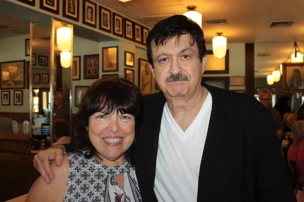 A Man With a Mustache Beside a Woman With Black Hair